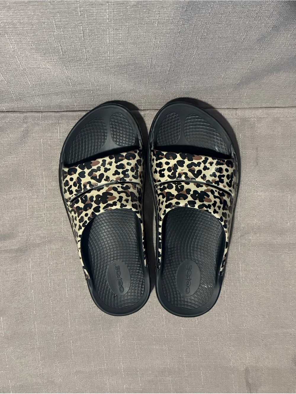 OOFOS Leopard Slide Sandals in Black and Beige